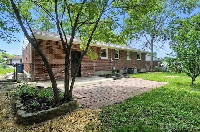 1378 Standish Ave, Riverside, OH 45432 - back of house featuring brick siding and a patio