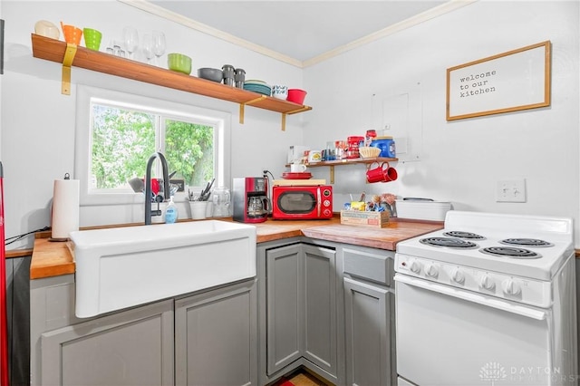 7109 Hancock, Russells Point, OH 43348 - kitchen with gray cabinets, open shelves, white electric range, and ornamental molding