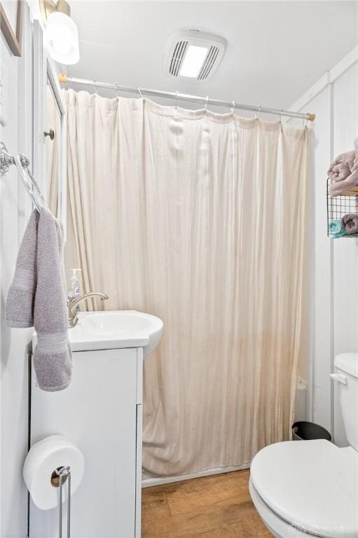 7109 Hancock, Russells Point, OH 43348 - bathroom with vanity, wood finished floors, and a shower with shower curtain