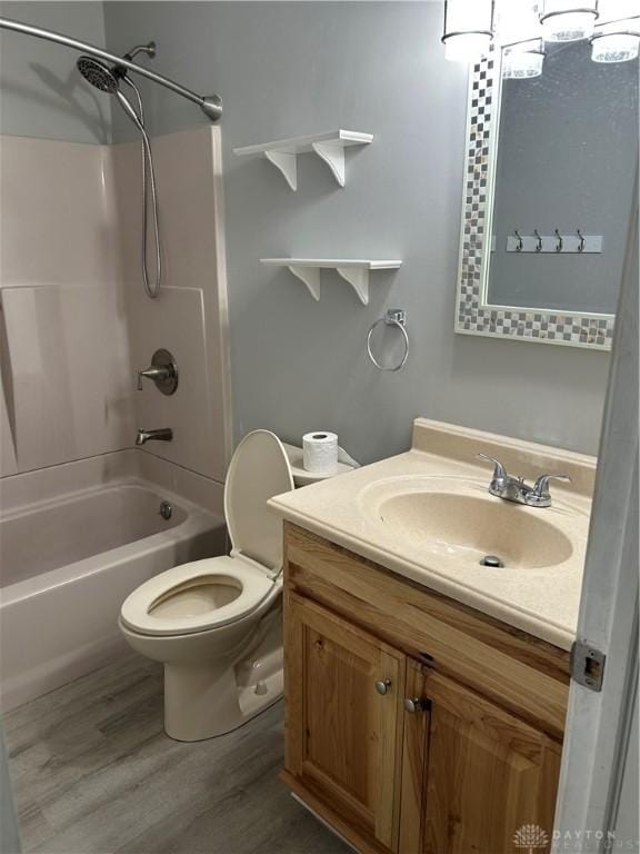 103 W Boitnott Dr, Englewood, OH 45322 - bathroom with vanity, washtub / shower combination, and wood finished floors