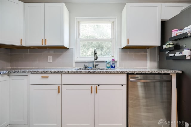 541 E Main St, Xenia, OH 45385 - kitchen with dishwasher, white cabinets, light stone counters, and decorative backsplash