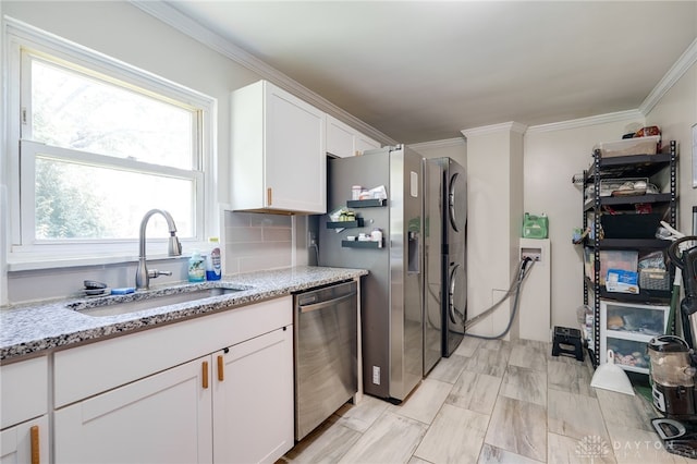 541 E Main St, Xenia, OH 45385 - kitchen with stainless steel appliances, white cabinetry, light stone countertops, ornamental molding, and decorative backsplash