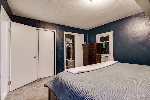 541 E Main St, Xenia, OH 45385 - carpeted bedroom featuring multiple closets, a textured ceiling, and cooling unit