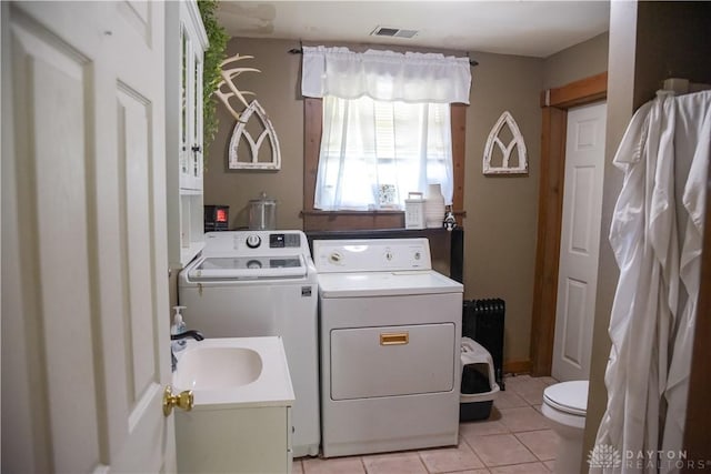 4741 Wolverton Rd, Eaton, OH 45320 - washroom with washer and dryer, light tile patterned floors, and radiator heating unit