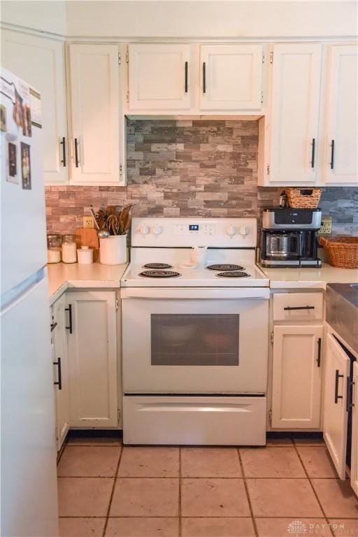 4741 Wolverton Rd, Eaton, OH 45320 - kitchen featuring white appliances, decorative backsplash, and light countertops