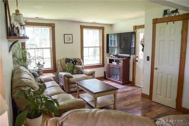 4741 Wolverton Rd, Eaton, OH 45320 - living room featuring dark wood-style flooring, plenty of natural light, and a fireplace