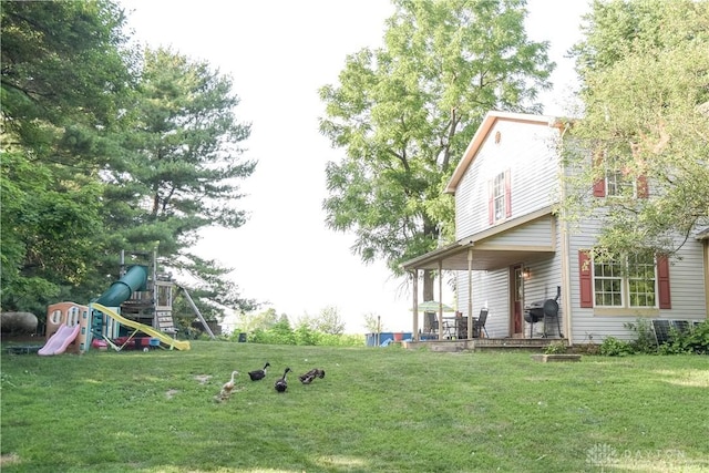 4741 Wolverton Rd, Eaton, OH 45320 - view of grassy yard featuring a playground