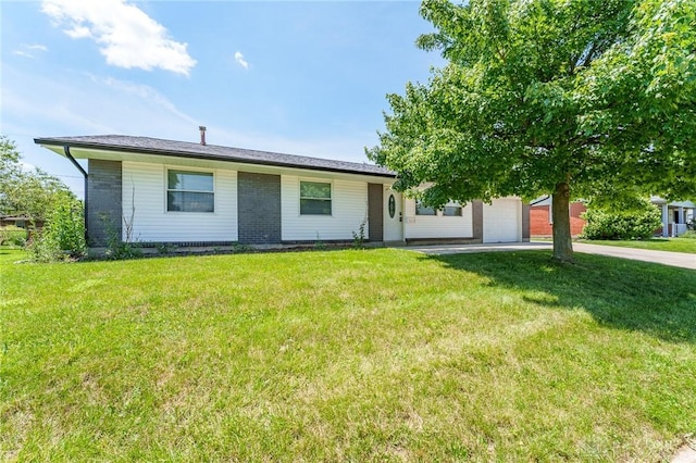1110 Langdale Ave, New Carlisle, OH 45344 - view of front of house featuring a garage, a front lawn, and brick siding