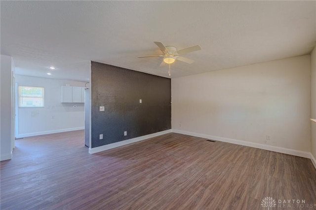 1110 Langdale Ave, New Carlisle, OH 45344 - unfurnished room with a ceiling fan and dark wood-type flooring