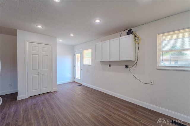 1110 Langdale Ave, New Carlisle, OH 45344 - empty room featuring dark wood-style floors, healthy amount of natural light, and recessed lighting