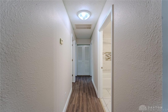 1110 Langdale Ave, New Carlisle, OH 45344 - hall featuring a textured wall and wood finished floors