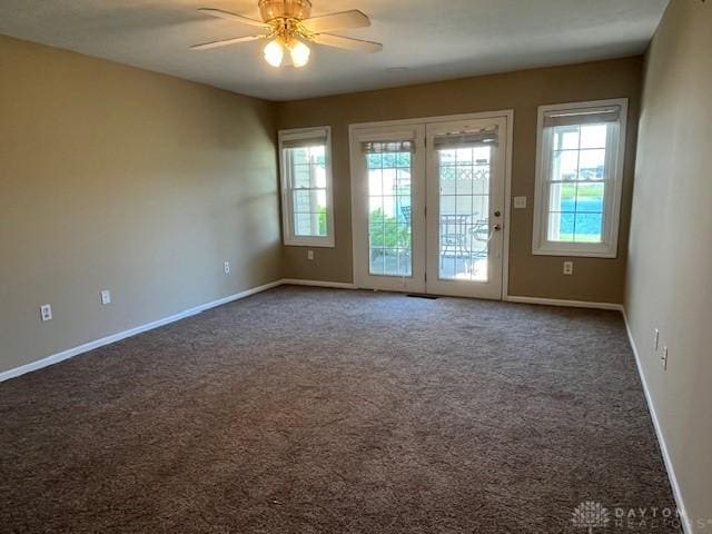 319 Sambor Ct, Piqua, OH 45356 - unfurnished room with ceiling fan, carpet, and french doors