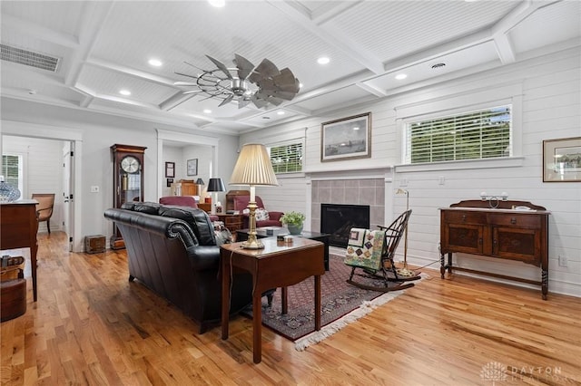 69 Bridge St, Cedarville Twp, OH 45314 - living room with coffered ceiling, light wood-style floors, ceiling fan, a fireplace, and healthy amount of natural light