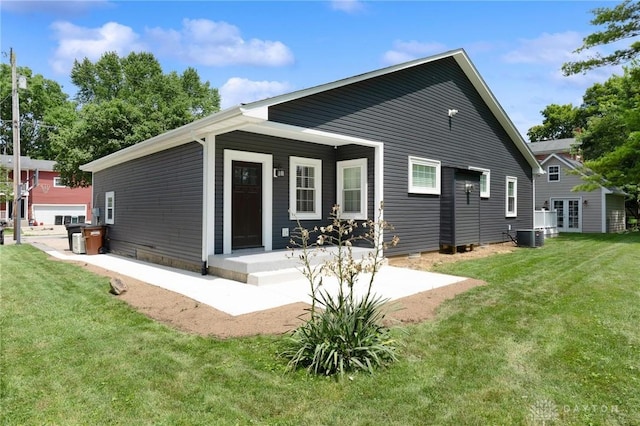 69 Bridge St, Cedarville Twp, OH 45314 - rear view of property with a yard and french doors