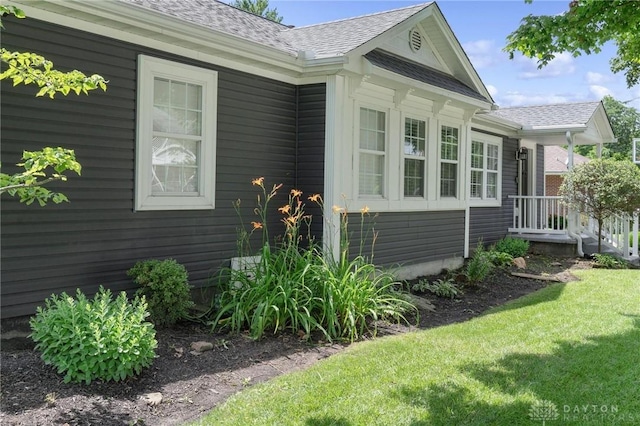69 Bridge St, Cedarville Twp, OH 45314 - view of property exterior featuring a shingled roof and a yard