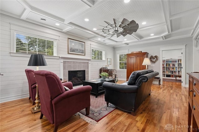 69 Bridge St, Cedarville Twp, OH 45314 - living area with coffered ceiling, light wood-type flooring, recessed lighting, a tile fireplace, and ceiling fan