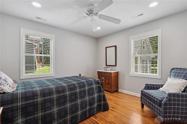 69 Bridge St, Cedarville Twp, OH 45314 - bedroom featuring light wood finished floors, multiple windows, recessed lighting, and ceiling fan