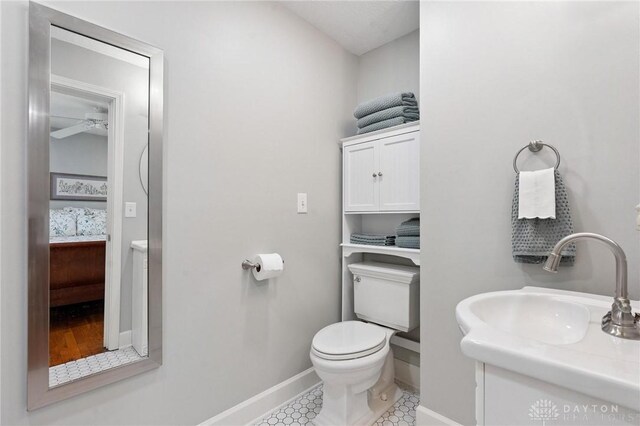 69 Bridge St, Cedarville Twp, OH 45314 - half bath featuring vanity, tile patterned flooring, and a ceiling fan