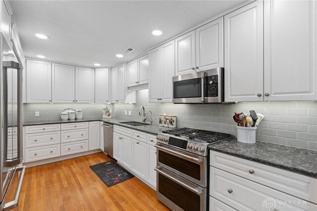 69 Bridge St, Cedarville Twp, OH 45314 - kitchen featuring stainless steel appliances, white cabinets, and recessed lighting