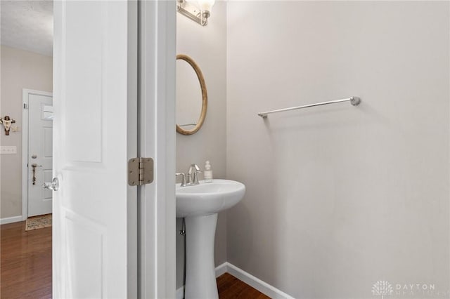 1681 S Branch Rd, Clearcreek Twp, OH 45458 - bathroom featuring baseboards and wood finished floors
