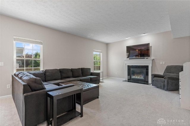 1681 S Branch Rd, Clearcreek Twp, OH 45458 - carpeted living area with a textured ceiling and a fireplace with flush hearth