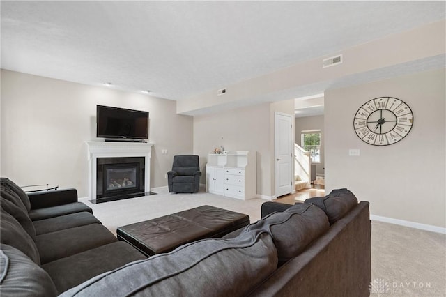 1681 S Branch Rd, Clearcreek Twp, OH 45458 - living area with light carpet and a fireplace with flush hearth
