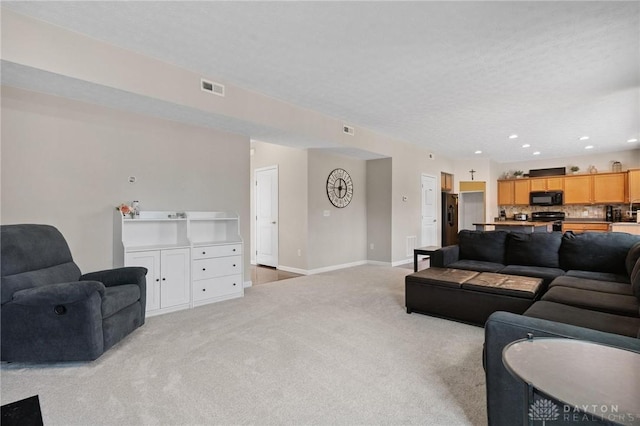 1681 S Branch Rd, Clearcreek Twp, OH 45458 - living room with light carpet and recessed lighting