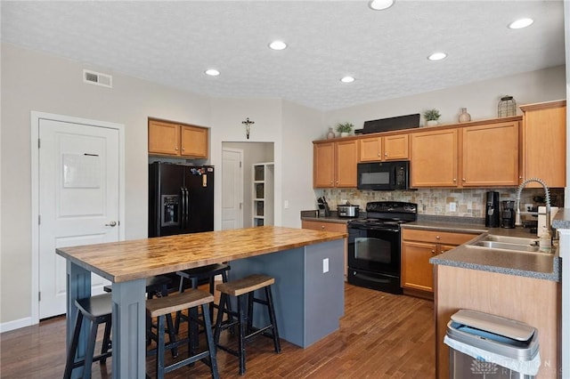 1681 S Branch Rd, Clearcreek Twp, OH 45458 - kitchen featuring black appliances, wooden counters, decorative backsplash, dark wood-style floors, and recessed lighting