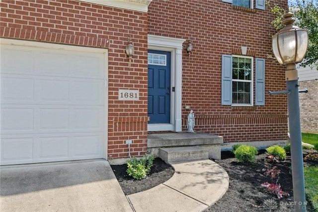 1681 S Branch Rd, Clearcreek Twp, OH 45458 - doorway to property featuring brick siding, a garage, and concrete driveway