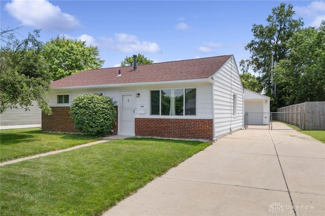 442 Kirkwood Dr, Fairborn, OH 45324 - view of front of property featuring brick siding, a garage, a gate, and a shingled roof