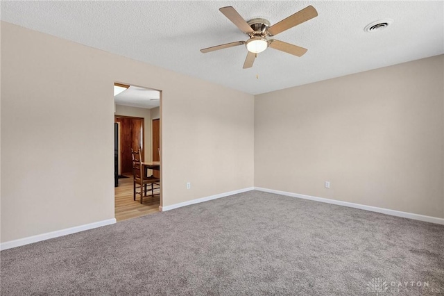 442 Kirkwood Dr, Fairborn, OH 45324 - carpeted empty room with ceiling fan and a textured ceiling
