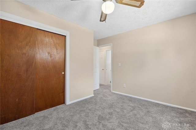 442 Kirkwood Dr, Fairborn, OH 45324 - unfurnished bedroom with carpet flooring, a closet, a textured ceiling, and ceiling fan
