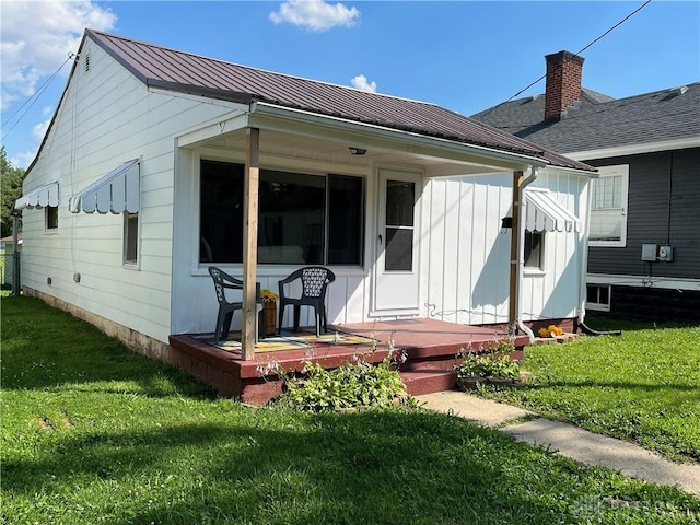 507 Broadway St, Washington Court Hous, OH 43160 - back of property featuring a yard, board and batten siding, and a metal roof