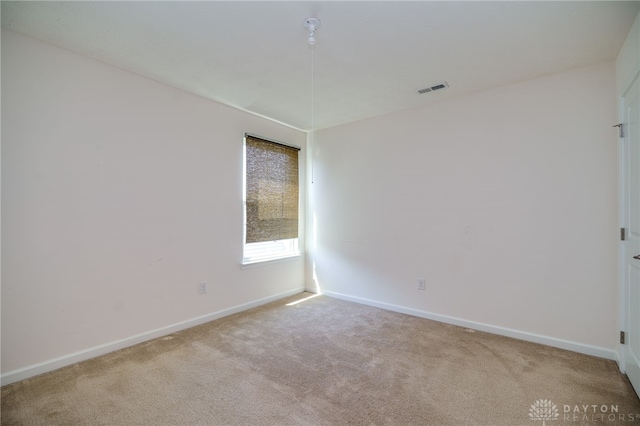 2933 E Ambrosia Ln, Xenia, OH 45385 - spare room featuring carpet and baseboards