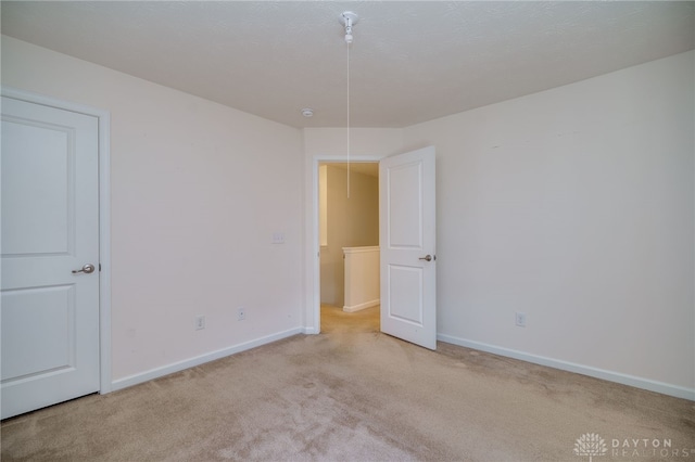 2933 E Ambrosia Ln, Xenia, OH 45385 - spare room with carpet and baseboards