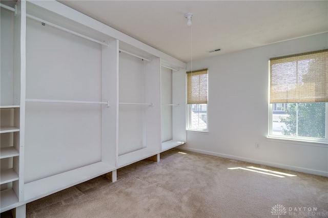 2933 E Ambrosia Ln, Xenia, OH 45385 - unfurnished bedroom with multiple windows and carpet flooring