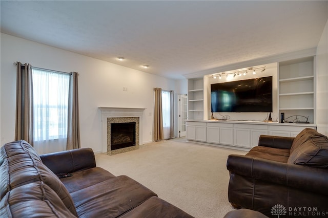 2933 E Ambrosia Ln, Xenia, OH 45385 - living area featuring light colored carpet and a fireplace with flush hearth