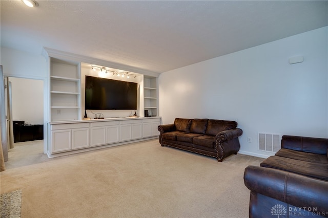 2933 E Ambrosia Ln, Xenia, OH 45385 - living room featuring light carpet and built in features