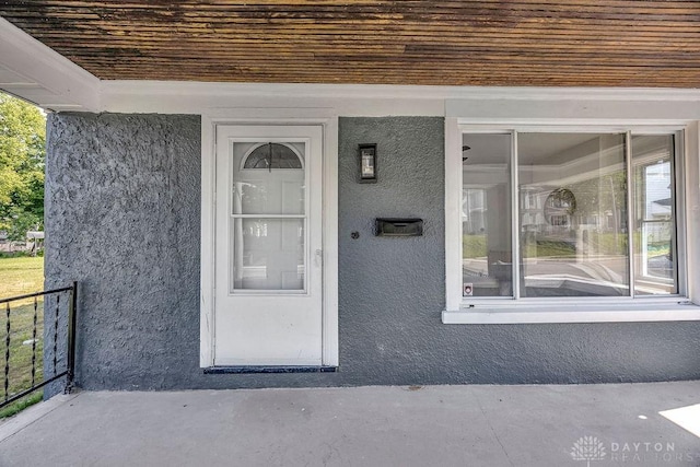 1200 Wyoming St, Dayton, OH 45410 - view of exterior entry featuring stucco siding