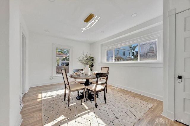 1200 Wyoming St, Dayton, OH 45410 - dining area featuring light wood-style flooring and baseboards