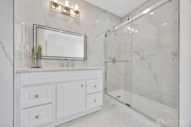 1200 Wyoming St, Dayton, OH 45410 - bathroom featuring a marble finish shower, marble finish floors, vanity, and a textured ceiling