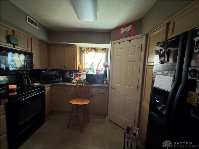 428 E Center St, Germantown, OH 45327 - kitchen featuring black appliances and a textured ceiling