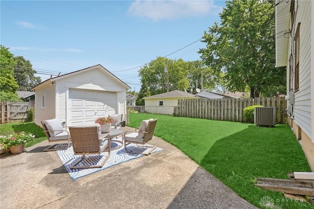 439 Monteray Ave, Oakwood, OH 45419 - fenced backyard featuring a garage, an outbuilding, a patio, and driveway