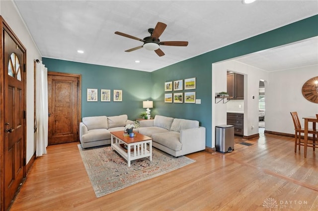 439 Monteray Ave, Oakwood, OH 45419 - living room featuring light wood-style flooring, ceiling fan, recessed lighting, and arched walkways