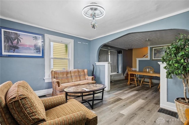 19 S Alder St Unit 21, Dayton, OH 45417 - living room with arched walkways, light wood-style flooring, and ornamental molding