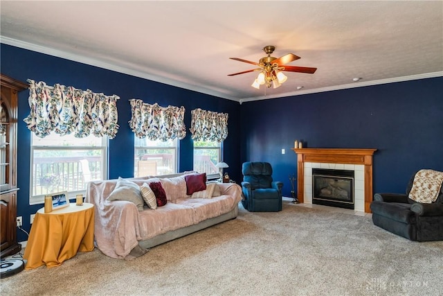24 Dinsley Pl, Springboro, OH 45066 - carpeted living area featuring a ceiling fan, a tile fireplace, and ornamental molding