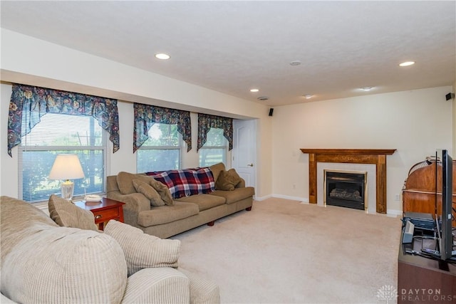 24 Dinsley Pl, Springboro, OH 45066 - living room with recessed lighting, carpet floors, and a glass covered fireplace