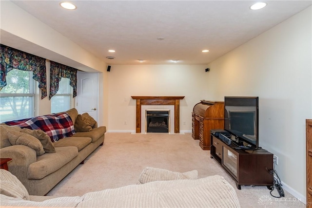 24 Dinsley Pl, Springboro, OH 45066 - living room with light colored carpet, recessed lighting, and a fireplace