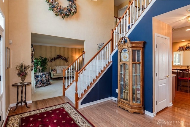 24 Dinsley Pl, Springboro, OH 45066 - foyer with wood finished floors, stairs, and a towering ceiling
