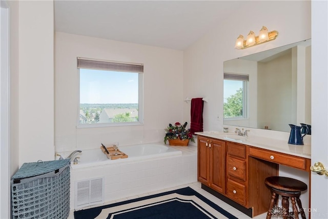 24 Dinsley Pl, Springboro, OH 45066 - full bathroom with vanity, a garden tub, and tile patterned floors